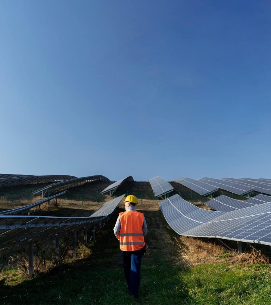 Engineer inspecting FACTIUN FIX® solar structures at a power plant.
